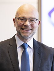 Portrait of Greg Reed.
